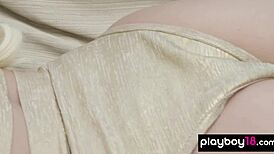 Blonde model Ria Rose cools her body outdoors in natural setting