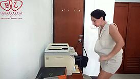 The silly secretary stumbled through a scanner mishap at work. Her naked antics baffled the boss while undressing.