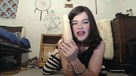 Horny tranny slut assfucks herself with gigantic dildo on webcam.
