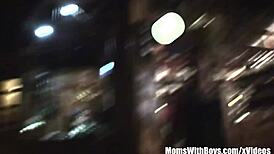 seasoned store owner interacts with young customers in the shop