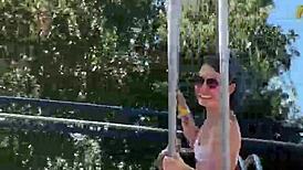 She gives a cute blowjob in public on the ferris wheel