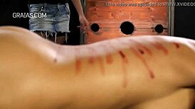 Domina Whips Her Redhead Slave in Tight Bondage