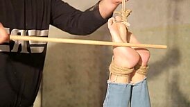 Aspiring slave endures falaka punishment in audition.