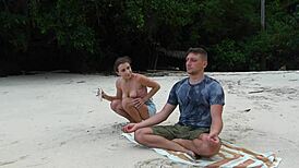 Girl gives sloppy blowjob on beach during meditation.