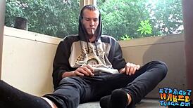 Naked homosexual thug smokes outdoors while masturbating his big hairy cock to cumshot