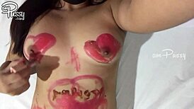 Amateur girl draws on her naked asian body with lipsticks