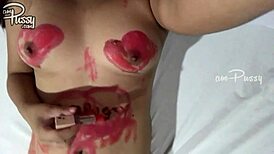 Amateur girl draws on her naked asian body with lipsticks