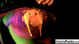 Discover busty Natasha's sexy solo masturbation under black lights