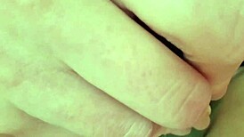 suggestive mature woman spreads legs for cucumber masturbation massage