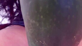 suggestive mature woman spreads legs for cucumber masturbation massage