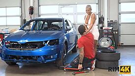 Busty Hottie Licks Mechanic's Ass in Garage