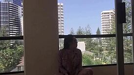 this ladyboy dances on the balcony with big tits