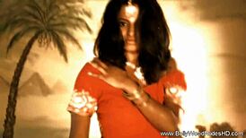 Seductive brunette teases with erotic dance and striptease