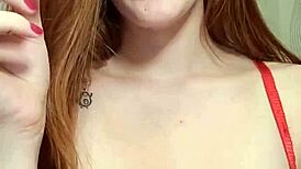 redhead lights up a cigarette and smokes