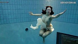 Andrea floats in the pool, showing her hottest ass underwater. 😍