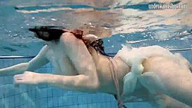 Andrea floats in the pool, showing her hottest ass underwater. 😍