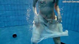 Andrea floats in the pool, showing her hottest ass underwater. 😍