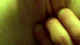 A redhead woman showcases her ginger-colored breasts in a natural setting.