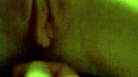 A redhead woman showcases her ginger-colored breasts in a natural setting.