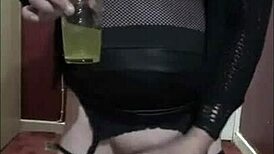 Homemade video of an amateur crossdresser taking a piss and a cumshot