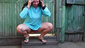 hey, wanna see a curvy milf piss near a fence outdoors?