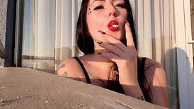 Beautiful Woman Smoking Cigarette In Fetish Video