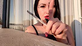 Beautiful Woman Smoking Cigarette In Fetish Video