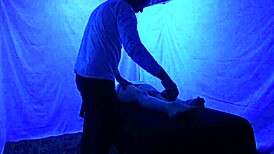 Gigi breeze receives detailed blacklight massage with fetish elements from black masseur