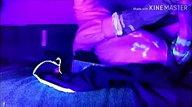 Watch this cosplay babe solo with large dildo under blacklight!