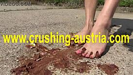 amber plays with feet and food outdoors