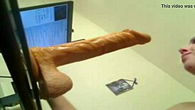 Blonde deep throats huge dildo in hardcore action