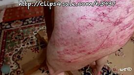 Red harsh whipping leaves brutal marks on submissive skin