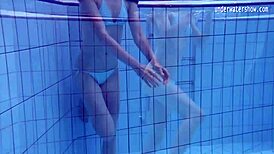 clara, petite 18+ teen, swims nude in underwater pool scene.