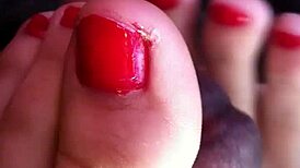 My friend gives an amazing footjob in the car, leading to cum