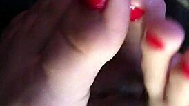 My friend gives an amazing footjob in the car, leading to cum