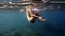 hot ginger swims underwater in tenerife pool