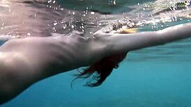 hot ginger swims underwater in tenerife pool