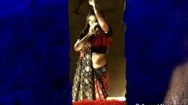 indian beauty reveals herself as a mystery lady in a serene setting