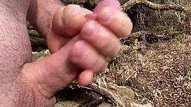 Cumming Hard by the River with a Curved Upwards Cock