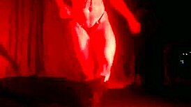 Stripper girl performs hot striptease with clothes ripped.