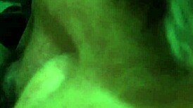 Mature woman receives oral attention in a subtle intimate setting.