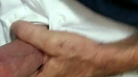 Mature woman receives oral attention in a subtle intimate setting.