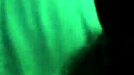 Mature woman receives oral attention in a subtle intimate setting.