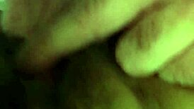 Mature woman receives oral attention in a subtle intimate setting.