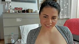 Cam girl 37 showing off her natural tits on webcam?
