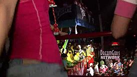 Spring break club flashing in night club outdoor setting.