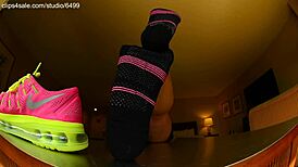 Tall girl shows sexy barefoot feet in Nike shoes for foot fetish domination