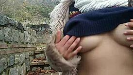 Passionate outdoor blowjob with natural tits flashing in the park