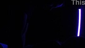 Carrie B indulging in blacklight sex with small tits.