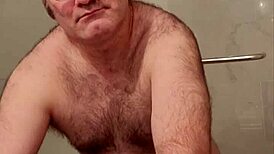 Martin Lavallée, naked, has fun by sliding a toy in his rectum and comparing to his erect cock the size of the device; he then falls on a black chastity lock